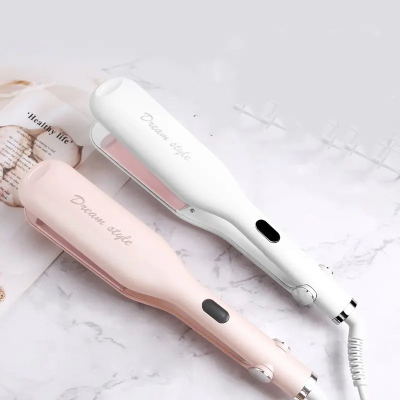 Hair straightener with 'Dream Style' branding on a marble surface